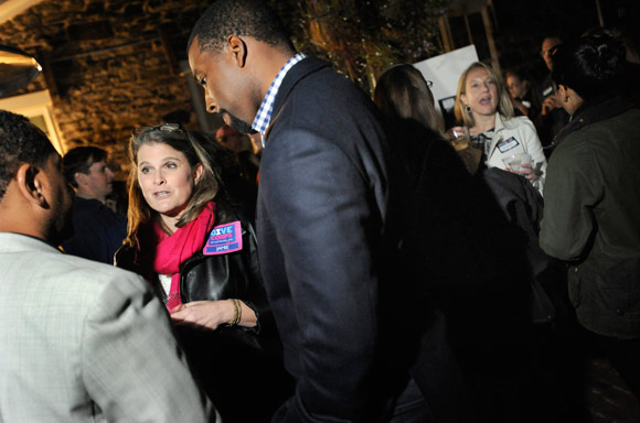 GiveCorps CEO Jamie McDonald chats with guests at a fundraiser
