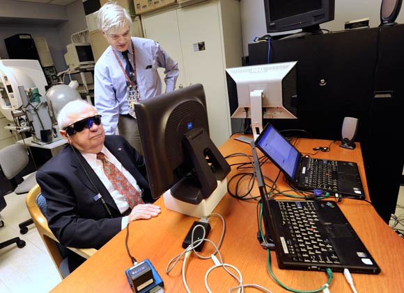 Dr. Gislin Dagnelie, right, tests the Argus II on blind subject Marion "Chick" Szczybor