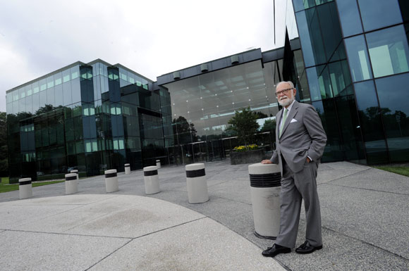 Architect William Schamu stands in front of the Marbury Building