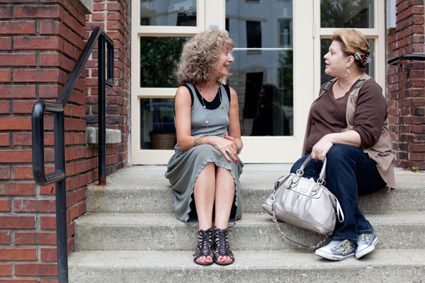 Joann Levy, Executive Director, the Women's Housing Coalition talks with Ann - Photo by Arianne Teep