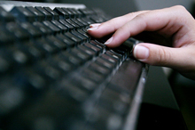 Stock image of an individual typing on a keyboard